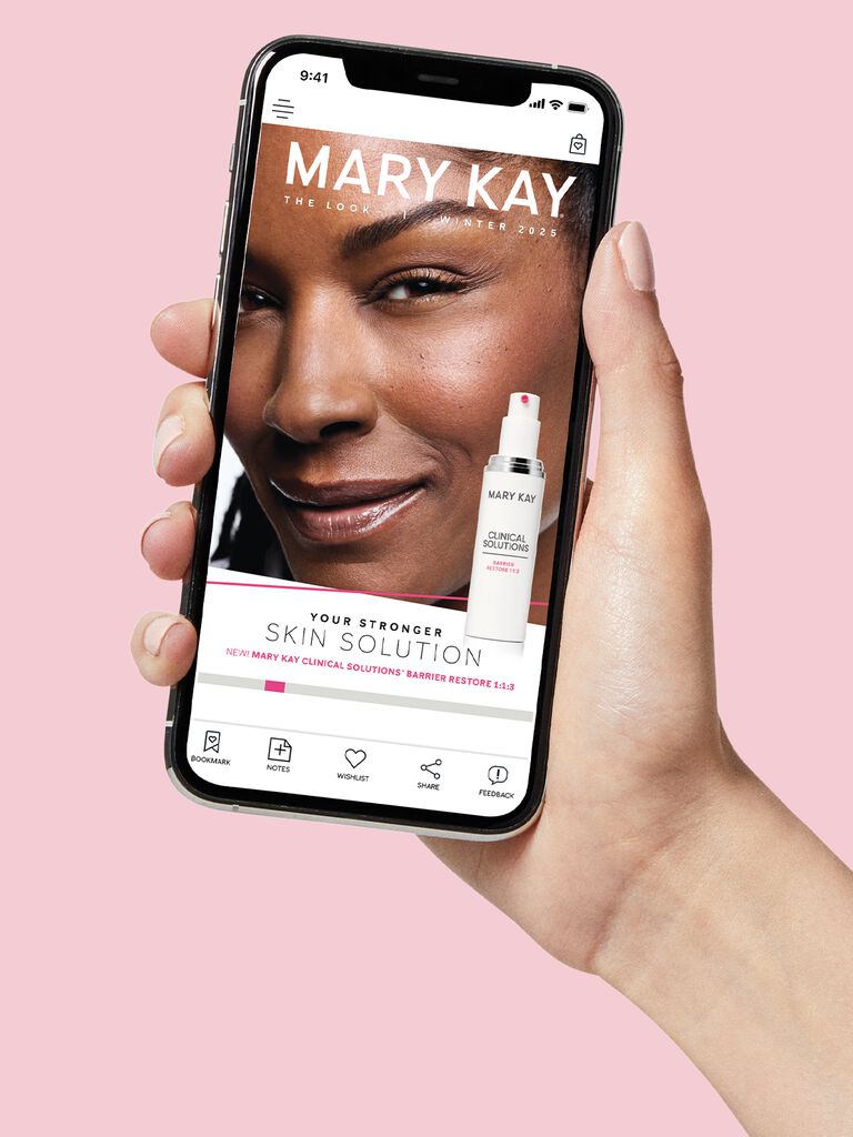 Hand holding phone with a Mary Kay Clinical Solutions Barrier Restore product promotion showing